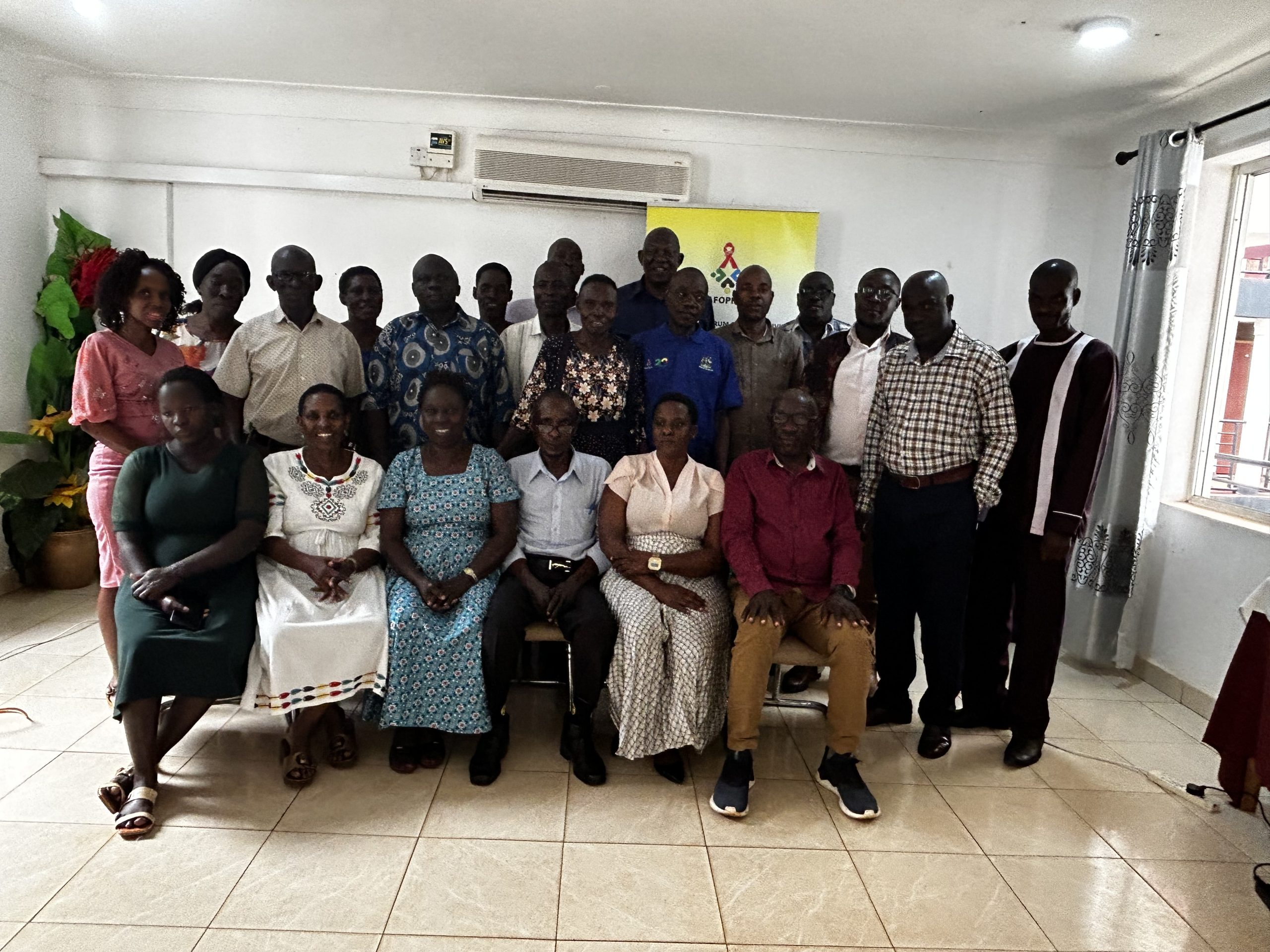 ED AGHA part of the team facilitating PLHIV leaders in Busoga Region